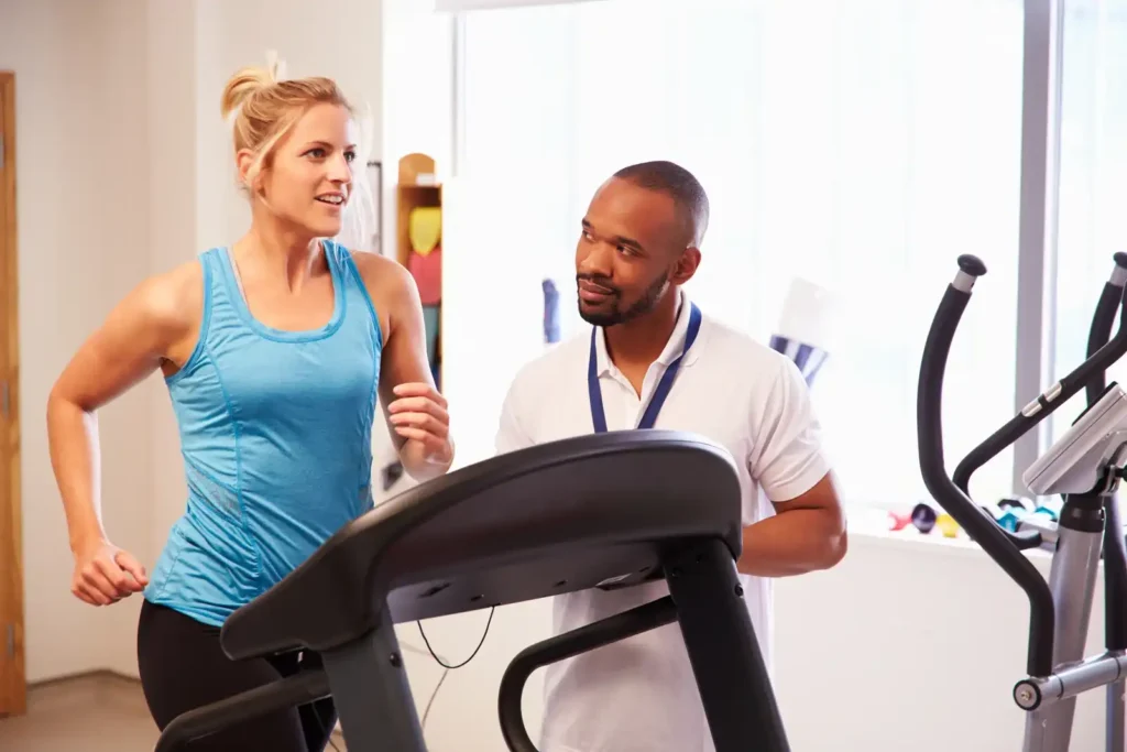 Patient Using Treadmill In Hospital Physiotherapy Department