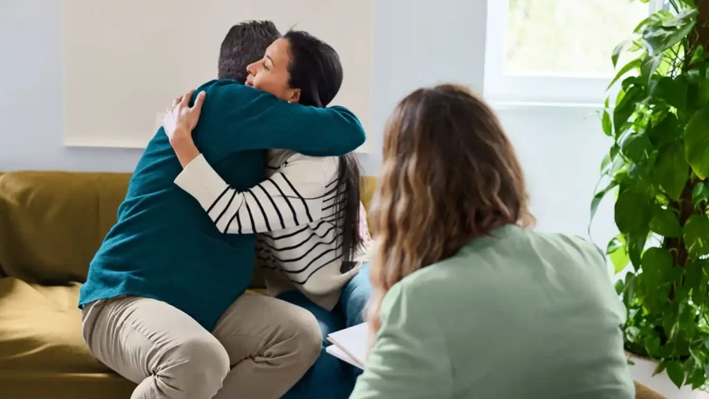 two people gently hugging each other
